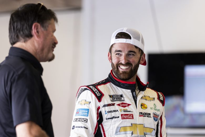 DAYTONA BEACH, FLORIDA - SEPTEMBER 07: Austin Dillon, Driver of the #3 NASCAR Next Gen car talks with a team member in the garage during the NASCAR Cup Series test at Daytona International Speedway on September 07, 2021 in Daytona Beach, Florida. (Photo by James Gilbert/Getty Images) | Getty Images