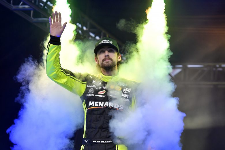 BRISTOL, TENNESSEE - SEPTEMBER 18: Ryan Blaney, driver of the #12 Menards/Richmond Ford, waves to fans as he walks on stage during pre-race ceremonies prior to the NASCAR Cup Series Bass Pro Shops Night Race at Bristol Motor Speedway on September 18, 2021 in Bristol, Tennessee. (Photo by Logan Riely/Getty Images) | Getty Images
