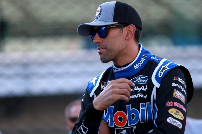INDIANAPOLIS, INDIANA - AUGUST 15: Aric Almirola, driver of the #10 Mobil 1 Ford, waits in the garage area during qualifying for the NASCAR Cup Series Verizon 200 at the Brickyard at Indianapolis Motor Speedway on August 15, 2021 in Indianapolis, Indiana. (Photo by Sean Gardner/Getty Images) | Getty Images