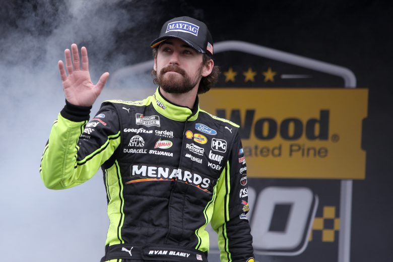 TALLADEGA, ALABAMA - OCTOBER 03: Ryan Blaney, driver of the #12 Menards/Maytag Ford, waves to fans as he walks on stage during pre-race ceremonies prior to the NASCAR Cup Series YellaWood 500 at Talladega Superspeedway on October 03, 2021 in Talladega, Alabama. (Photo by Sean Gardner/Getty Images) | Getty Images