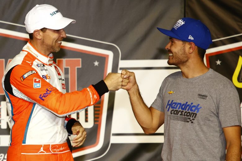DARLINGTON, SOUTH CAROLINA - SEPTEMBER 05: Kyle Larson, driver of the #5 HendrickCars.com Chevrolet, congratulates Denny Hamlin, driver of the #11 Offerpad Toyota, in the Ruoff Mortgage victory lane after winning the NASCAR Cup Series Cook Out Southern 500 at Darlington Raceway on September 05, 2021 in Darlington, South Carolina. (Photo by Jared C. Tilton/Getty Images) | Getty Images