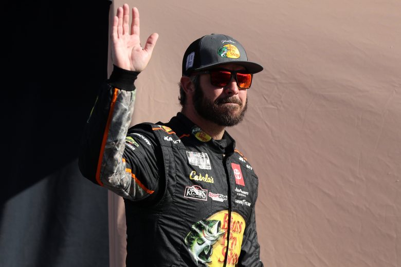 LAS VEGAS, NEVADA - SEPTEMBER 26: Martin Truex Jr., driver of the #19 Bass Pro Shops Toyota, waves to fans during pre-race ceremonies prior to the NASCAR Cup Series South Point 400 at Las Vegas Motor Speedway on September 26, 2021 in Las Vegas, Nevada. (Photo by Meg Oliphant/Getty Images) | Getty Images