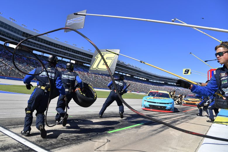 FORT WORTH, TEXAS - OCTOBER 16: The pit crew of the #16 Andy's Frozen Custard Chevrolet, driven by AJ Allmendinger leap into action during the NASCAR Xfinity Series Andy's Frozen Custard 335 at Texas Motor Speedway on October 16, 2021 in Fort Worth, Texas. (Photo by Logan Riely/Getty Images) | Getty Images