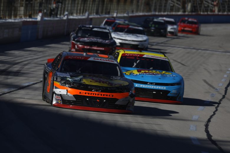FORT WORTH, TEXAS - OCTOBER 16: Noah Gragson, driver of the #9 Bass Pro Shops/TrueTimber/BRCC Chevrolet, and AJ Allmendinger, driver of the #16 Andy's Frozen Custard Chevrolet, race during the NASCAR Xfinity Series Andy's Frozen Custard 335 at Texas Motor Speedway on October 16, 2021 in Fort Worth, Texas. (Photo by Jared C. Tilton/Getty Images) | Getty Images