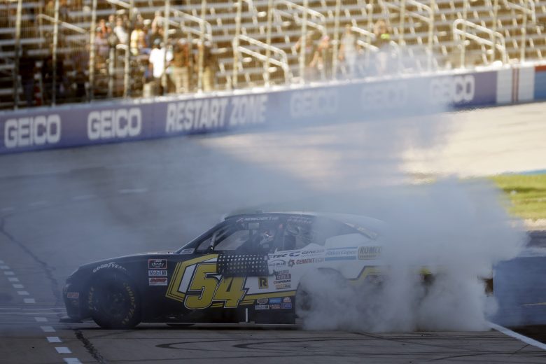 FORT WORTH, TEXAS - OCTOBER 16: John H. Nemechek, driver of the #54 Romco Equipment Toyota, celebrates with a burnout after winning the NASCAR Xfinity Series Andy's Frozen Custard 335 at Texas Motor Speedway on October 16, 2021 in Fort Worth, Texas. (Photo by Jared C. Tilton/Getty Images) | Getty Images