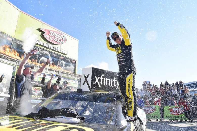 FORT WORTH, TEXAS - OCTOBER 16: John H. Nemechek, driver of the #54 Romco Equipment Toyota, speaks on a cell phone in victory lane after winning the NASCAR Xfinity Series Andy's Frozen Custard 335 at Texas Motor Speedway on October 16, 2021 in Fort Worth, Texas. (Photo by Logan Riely/Getty Images) | Getty Images