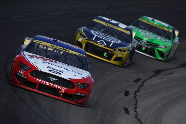 FORT WORTH, TEXAS - OCTOBER 17: Joey Logano, driver of the #22 AAA Insurance Ford, Chase Elliott, driver of the #9 Kelley Blue Book Chevrolet, and Kyle Busch, driver of the #18 Interstate Batteries Toyota, race during the NASCAR Cup Series Autotrader EchoPark Automotive 500 at Texas Motor Speedway on October 17, 2021 in Fort Worth, Texas. (Photo by Sean Gardner/Getty Images) | Getty Images