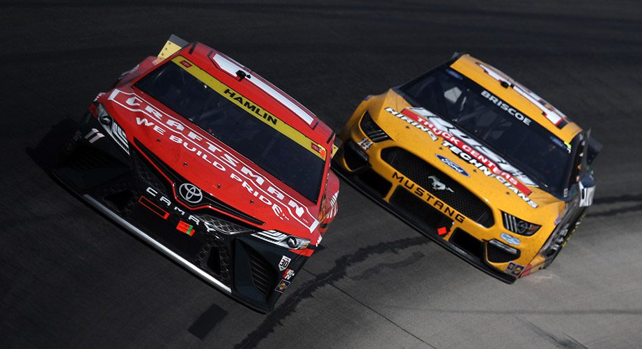 FORT WORTH, TEXAS - OCTOBER 17: Denny Hamlin, driver of the #11 Craftsman Toyota, and Chase Briscoe, driver of the #14 Rush Truck Centers/Cummins Ford, race during the NASCAR Cup Series Autotrader EchoPark Automotive 500 at Texas Motor Speedway on October 17, 2021 in Fort Worth, Texas. (Photo by Sean Gardner/Getty Images) | Getty Images
