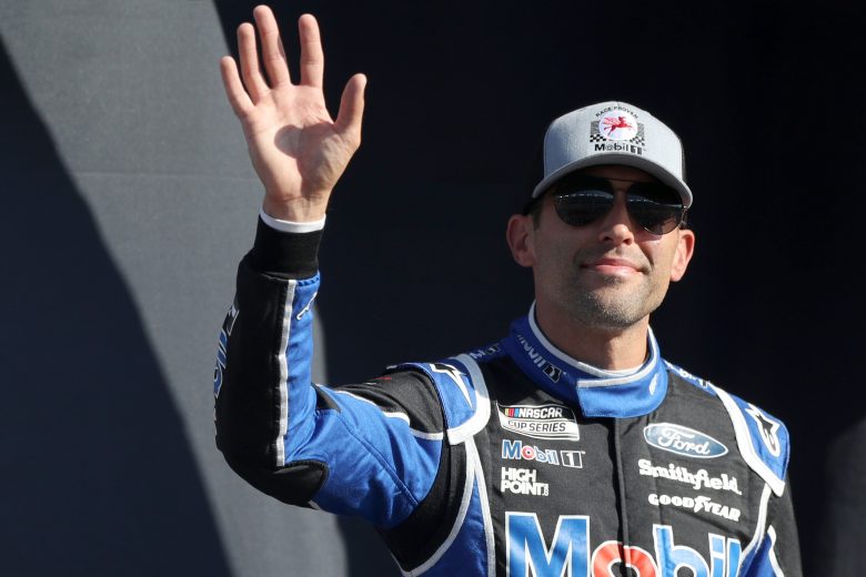 LAS VEGAS, NEVADA - SEPTEMBER 26: Aric Almirola, driver of the #10 Mobil 1 Ford, waves to fans during pre-race ceremonies prior to the NASCAR Cup Series South Point 400 at Las Vegas Motor Speedway on September 26, 2021 in Las Vegas, Nevada. (Photo by Meg Oliphant/Getty Images) | Getty Images