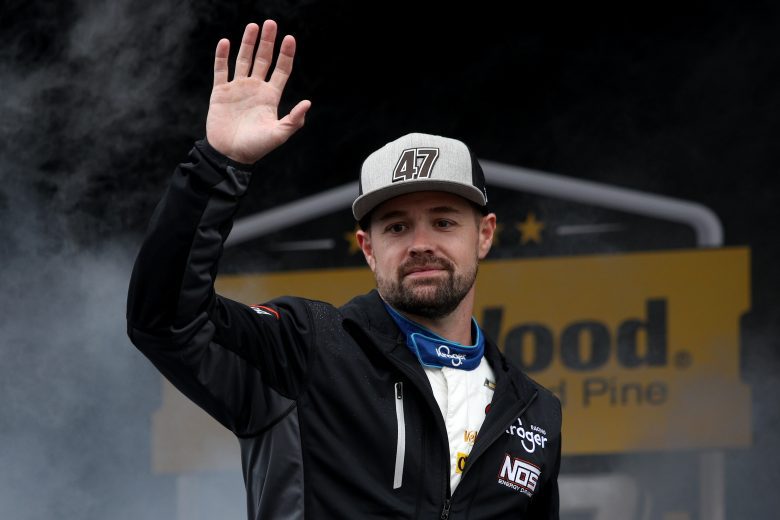 TALLADEGA, ALABAMA - OCTOBER 03: Ricky Stenhouse Jr., driver of the #47 SunnyD Chevrolet, waves to fans as he walks on stage during pre-race ceremonies prior to the NASCAR Cup Series YellaWood 500 at Talladega Superspeedway on October 03, 2021 in Talladega, Alabama. (Photo by Sean Gardner/Getty Images) | Getty Images