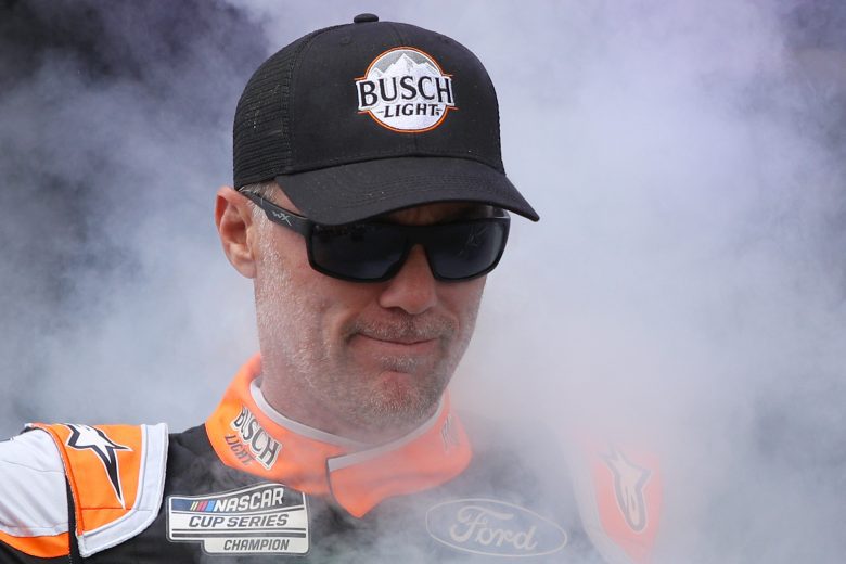 TALLADEGA, ALABAMA - OCTOBER 03: Kevin Harvick, driver of the #4 Busch Light #Hunt4Busch Ford, walks on stage during pre-race ceremonies prior to the NASCAR Cup Series YellaWood 500 at Talladega Superspeedway on October 03, 2021 in Talladega, Alabama. (Photo by Sean Gardner/Getty Images) | Getty Images