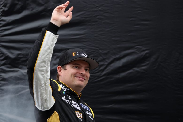 TALLADEGA, ALABAMA - OCTOBER 03: Cole Custer, driver of the #41 Autodesk/HaasTooling.com Ford, waves to fans as he walks on stage during pre-race ceremonies prior to the NASCAR Cup Series YellaWood 500 at Talladega Superspeedway on October 03, 2021 in Talladega, Alabama. (Photo by Sean Gardner/Getty Images) | Getty Images