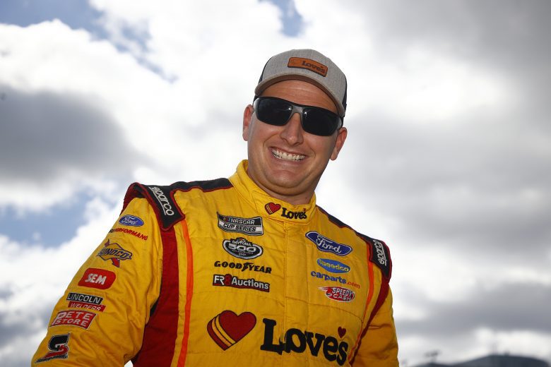 CONCORD, NORTH CAROLINA - OCTOBER 10: Michael McDowell, driver of the #34 Love's Travel Stops Ford, walks the grid prior to the NASCAR Cup Series Bank of America ROVAL 400 at Charlotte Motor Speedway on October 10, 2021 in Concord, North Carolina. (Photo by Jared C. Tilton/Getty Images) | Getty Images