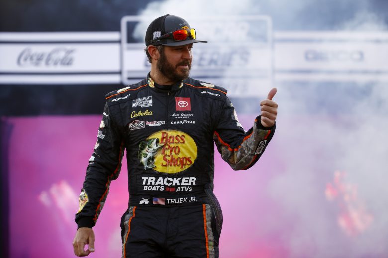 RICHMOND, VIRGINIA - SEPTEMBER 11: Martin Truex Jr., driver of the #19 Bass Pro Shops Toyota, is introduced during pre-race ceremonies prior to the NASCAR Cup Series Federated Auto Parts 400 Salute to First Responders at Richmond Raceway on September 11, 2021 in Richmond, Virginia. (Photo by Jared C. Tilton/Getty Images) | Getty Images