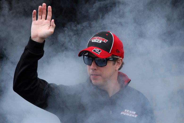 TALLADEGA, ALABAMA - OCTOBER 03: Brad Keselowski, driver of the #2 Discount Tire Ford, waves to fans as he walks on stage during pre-race ceremonies prior to the NASCAR Cup Series YellaWood 500 at Talladega Superspeedway on October 03, 2021 in Talladega, Alabama. (Photo by Sean Gardner/Getty Images) | Getty Images
