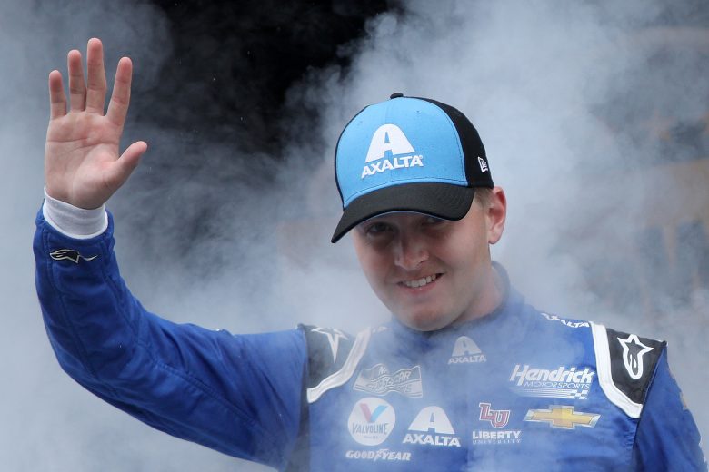 TALLADEGA, ALABAMA - OCTOBER 03: William Byron, driver of the #24 Axalta Chevrolet, waves to fans as he walks on stage during pre-race ceremonies prior to the NASCAR Cup Series YellaWood 500 at Talladega Superspeedway on October 03, 2021 in Talladega, Alabama. (Photo by Sean Gardner/Getty Images) | Getty Images