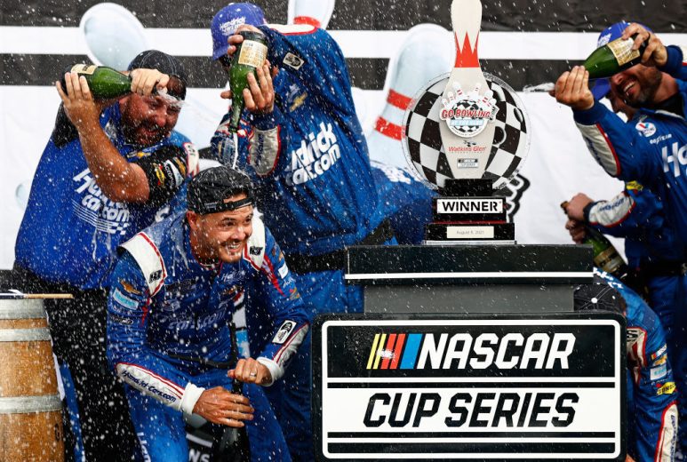 WATKINS GLEN, NEW YORK - AUGUST 08: Kyle Larson, driver of the #5 HendrickCars.com Chevrolet, and crew celebrate in the Ruoff Mortgage victory lane after winning the NASCAR Cup Series Go Bowling at The Glen at Watkins Glen International on August 08, 2021 in Watkins Glen, New York. (Photo by Jared C. Tilton/Getty Images) | Getty Images