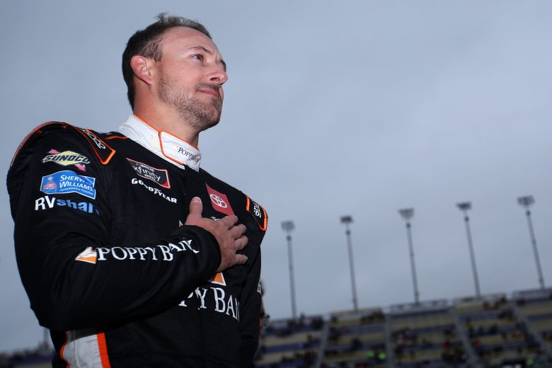 KANSAS CITY, KANSAS - OCTOBER 23: Daniel Hemric, driver of the #18 Poppy Bank Toyota, stands on the grid during the national anthem prior to the NASCAR Xfinity Series Kansas Lottery 300 at Kansas Speedway on October 23, 2021 in Kansas City, Kansas. (Photo by Sean Gardner/Getty Images) | Getty Images