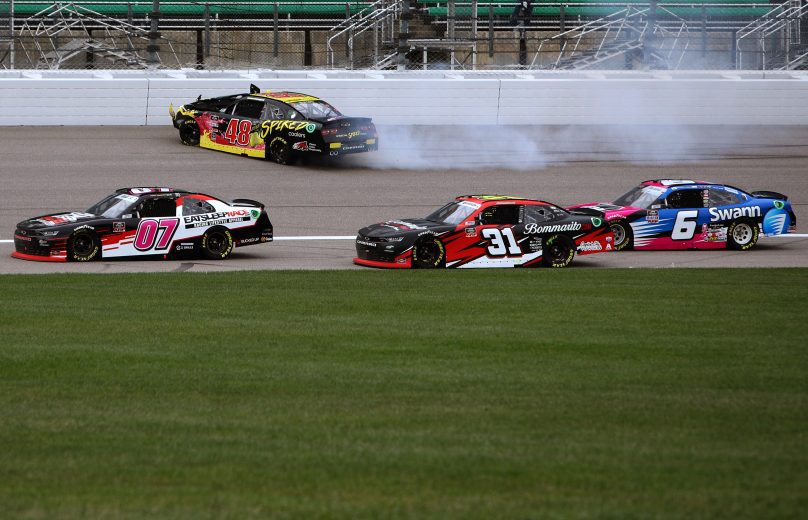 KANSAS CITY, KANSAS - OCTOBER 23: Jade Buford, driver of the #48 Big Machine Spiked Coolers Chevrolet, spins into the wall as Joe Graf Jr., driver of the #07 EatSleepRace Chevrolet, Jordan Anderson, driver of the #31 Bommarito Automotive Group Chevrolet, and Ryan Vargas, driver of the #6 Swann Communications Chevrolet, pass during the NASCAR Xfinity Series Kansas Lottery 300 at Kansas Speedway on October 23, 2021 in Kansas City, Kansas. (Photo by Sean Gardner/Getty Images) | Getty Images