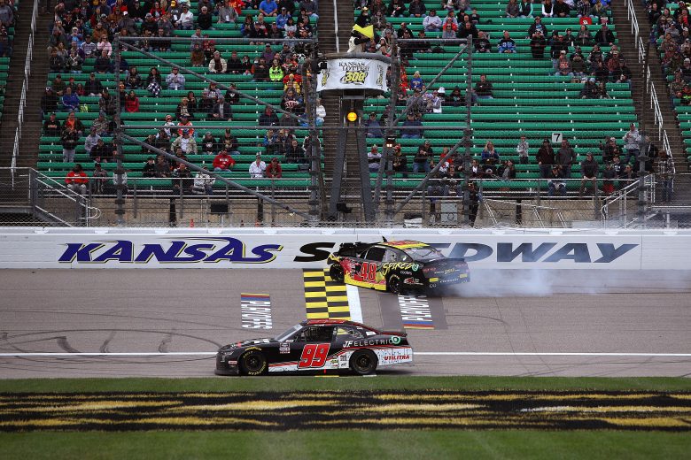 KANSAS CITY, KANSAS - OCTOBER 23: Jade Buford, driver of the #48 Big Machine Spiked Coolers Chevrolet, spins into the wall as Matt Mills, driver of the #99 J.F. Electric Chevrolet, drives by during the NASCAR Xfinity Series Kansas Lottery 300 at Kansas Speedway on October 23, 2021 in Kansas City, Kansas. (Photo by Sean Gardner/Getty Images) | Getty Images