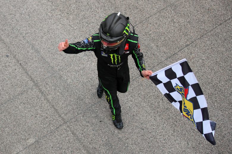 KANSAS CITY, KANSAS - OCTOBER 23: Ty Gibbs, driver of the #54 Monster Energy Toyota, celebrates with the checkered flag after winning the NASCAR Xfinity Series Kansas Lottery 300 at Kansas Speedway on October 23, 2021 in Kansas City, Kansas. (Photo by Meg Oliphant/Getty Images) | Getty Images