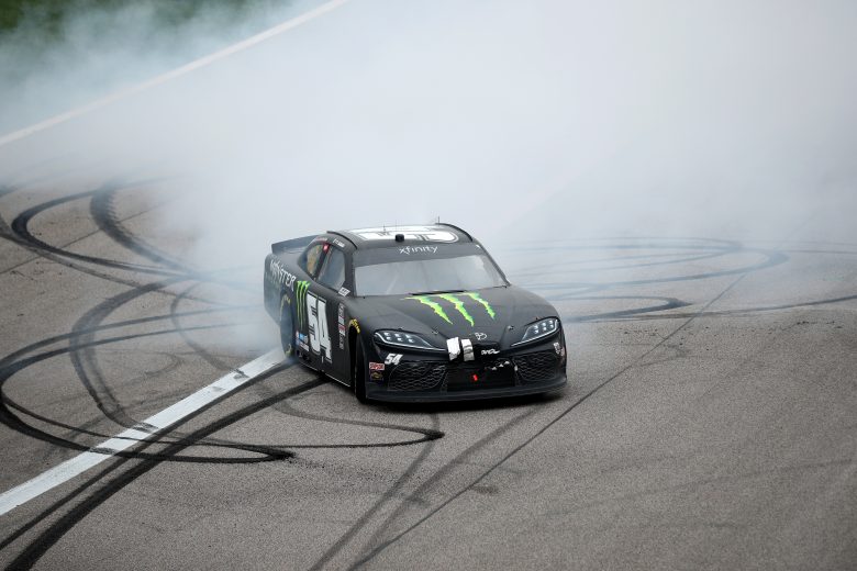 KANSAS CITY, KANSAS - OCTOBER 23: Ty Gibbs, driver of the #54 Monster Energy Toyota, celebrates with a burnout after winning the NASCAR Xfinity Series Kansas Lottery 300 at Kansas Speedway on October 23, 2021 in Kansas City, Kansas. (Photo by Meg Oliphant/Getty Images) | Getty Images