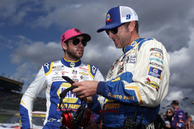 KANSAS CITY, KANSAS - OCTOBER 24: Chase Elliott, driver of the #9 NAPA Auto Parts Chevrolet, (L) and crew chief Alan Gustafson talk on the grid prior to the NASCAR Cup Series Hollywood Casino 400 at Kansas Speedway on October 24, 2021 in Kansas City, Kansas. (Photo by Sean Gardner/Getty Images) | Getty Images