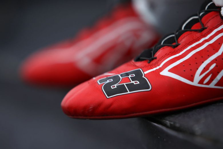 KANSAS CITY, KANSAS - OCTOBER 24: A detail of the shoes worn by Bubba Wallace, driver of the #23 Door Dash Toyota, prior to the NASCAR Cup Series Hollywood Casino 400 at Kansas Speedway on October 24, 2021 in Kansas City, Kansas. (Photo by Sean Gardner/Getty Images) | Getty Images