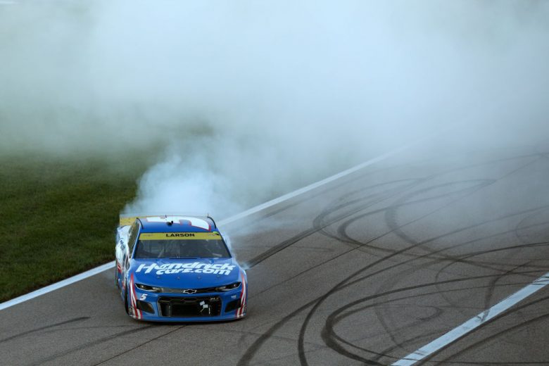 KANSAS CITY, KANSAS - OCTOBER 24: Kyle Larson, driver of the #5 HendrickCars.com Chevrolet, celebrates with a burnout after winning the NASCAR Cup Series Hollywood Casino 400 at Kansas Speedway on October 24, 2021 in Kansas City, Kansas. (Photo by Meg Oliphant/Getty Images) | Getty Images