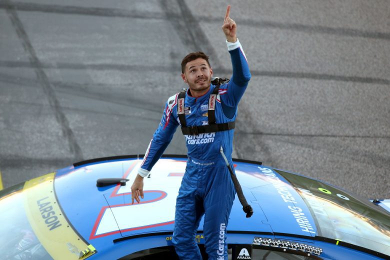 KANSAS CITY, KANSAS - OCTOBER 24: Kyle Larson, driver of the #5 HendrickCars.com Chevrolet, points toward the sky, as he celebrates winning the NASCAR Cup Series Hollywood Casino 400 at Kansas Speedway on October 24, 2021 in Kansas City, Kansas. (Photo by Meg Oliphant/Getty Images) | Getty Images