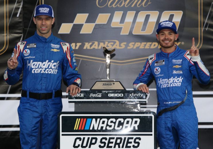 KANSAS CITY, KANSAS - OCTOBER 24: Kyle Larson, driver of the #5 HendrickCars.com Chevrolet, and crew chief Cliff Daniels celebrate in the Ruoff Mortgage victory lane after winning the NASCAR Cup Series Hollywood Casino 400 at Kansas Speedway on October 24, 2021 in Kansas City, Kansas. (Photo by Sean Gardner/Getty Images) | Getty Images