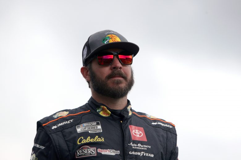 KANSAS CITY, KANSAS - OCTOBER 24: Martin Truex Jr., driver of the #19 Bass Pro Shops Toyota, walks onstage during pre-race ceremonies prior to the NASCAR Cup Series Hollywood Casino 400 at Kansas Speedway on October 24, 2021 in Kansas City, Kansas. (Photo by Sean Gardner/Getty Images) | Getty Images