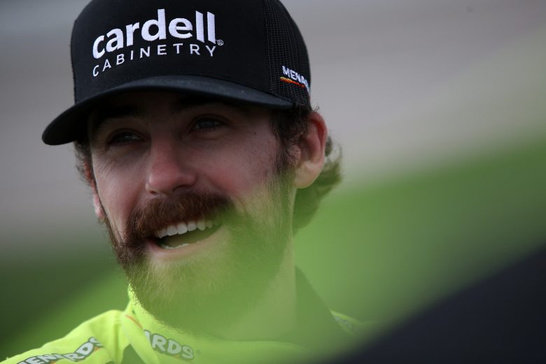 KANSAS CITY, KANSAS - OCTOBER 24: Ryan Blaney, driver of the #12 Menards/Cardell Cabinetry Ford, waits on the grid prior to the NASCAR Cup Series Hollywood Casino 400 at Kansas Speedway on October 24, 2021 in Kansas City, Kansas. (Photo by Sean Gardner/Getty Images) | Getty Images