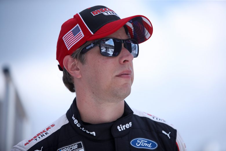 BROOKLYN, MICHIGAN - AUGUST 22: Brad Keselowski, driver of the #2 Discount Tire Ford, walks on stage during driver introductions prior to the NASCAR Cup Series FireKeepers Casino 400 at Michigan International Speedway on August 22, 2021 in Brooklyn, Michigan. (Photo by Sean Gardner/Getty Images) | Getty Images