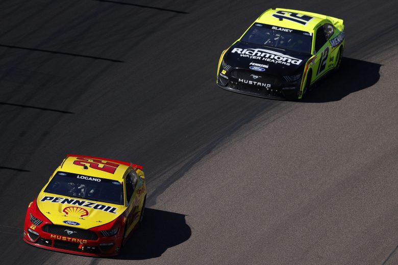 AVONDALE, ARIZONA - MARCH 14: Joey Logano, driver of the #22 Shell Pennzoil Ford, and Ryan Blaney, driver of the #12 Menards/Richmond Water Heaters Ford, race during the NASCAR Cup Series Instacart 500 at Phoenix Raceway on March 14, 2021 in Avondale, Arizona. (Photo by Christian Petersen/Getty Images) | Getty Images