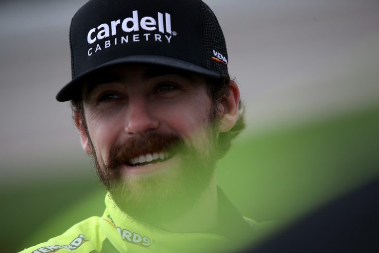 KANSAS CITY, KANSAS - OCTOBER 24: Ryan Blaney, driver of the #12 Menards/Cardell Cabinetry Ford, waits on the grid prior to the NASCAR Cup Series Hollywood Casino 400 at Kansas Speedway on October 24, 2021 in Kansas City, Kansas. (Photo by Sean Gardner/Getty Images) | Getty Images