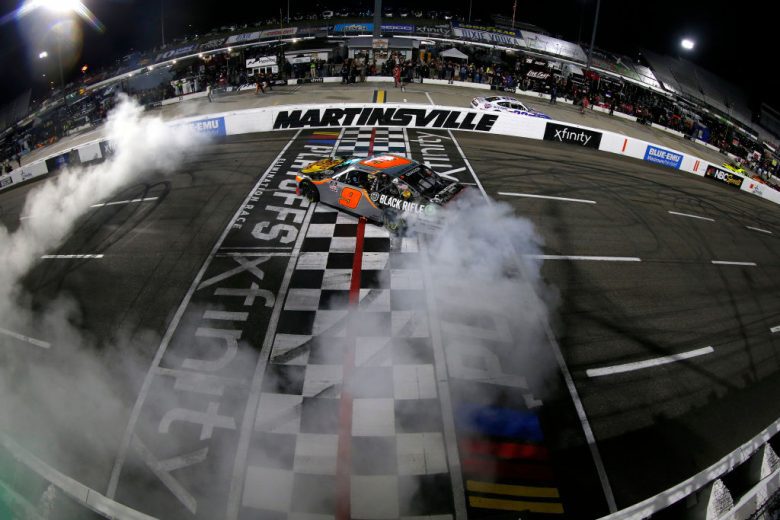 MARTINSVILLE, VIRGINIA - OCTOBER 30: Noah Gragson, driver of the #9 Bass Pro Shops/TrueTimber/BRCC Chevrolet, celebrates with a burnout after winning the NASCAR Xfinity Series Dead on Tools 250 at Martinsville Speedway on October 30, 2021 in Martinsville, Virginia. (Photo by Brian Lawdermilk/Getty Images) | Getty Images