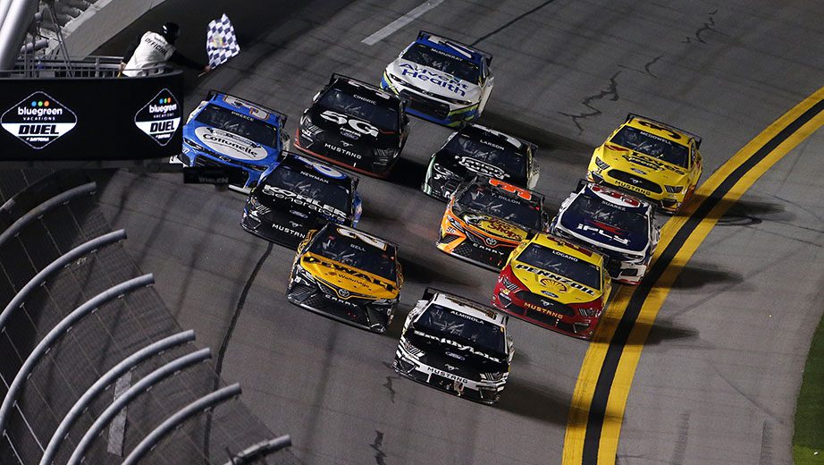 DAYTONA BEACH, FLORIDA - FEBRUARY 11: Aric Almirola, driver of the #10 Smithfield Ford, takes the checkered flag to win the NASCAR Cup Series Bluegreen Vacations Duel #1 at Daytona International Speedway on February 11, 2021 in Daytona Beach, Florida. (Photo by Brian Lawdermilk/Getty Images) | Getty Images