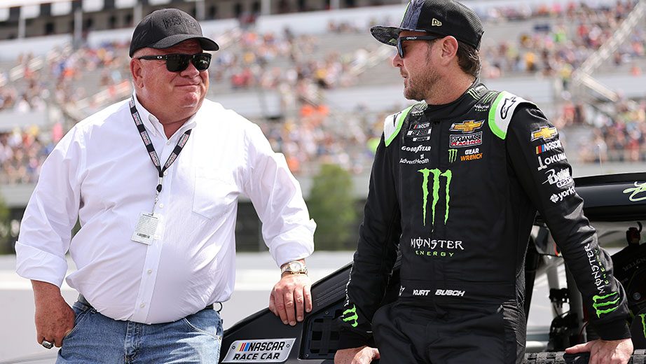 LONG POND, PENNSYLVANIA - JUNE 26: Kurt Busch, driver of the #1 Monster Energy Chevrolet, and team owner Chip Ganassi talk on the grid prior to the NASCAR Cup Series Pocono Organics CBD 325 at Pocono Raceway on June 26, 2021 in Long Pond, Pennsylvania. (Photo by James Gilbert/Getty Images) | Getty Images