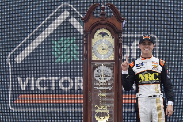 MARTINSVILLE, VIRGINIA - OCTOBER 30: Zane Smith, driver of the #21 MRC Construction Chevrolet, celebrates in the Ruoff Mortgage victory lane after winning the NASCAR Camping World Truck Series United Rentals 200 at Martinsville Speedway on October 30, 2021 in Martinsville, Virginia. (Photo by Logan Riely/Getty Images) | Getty Images