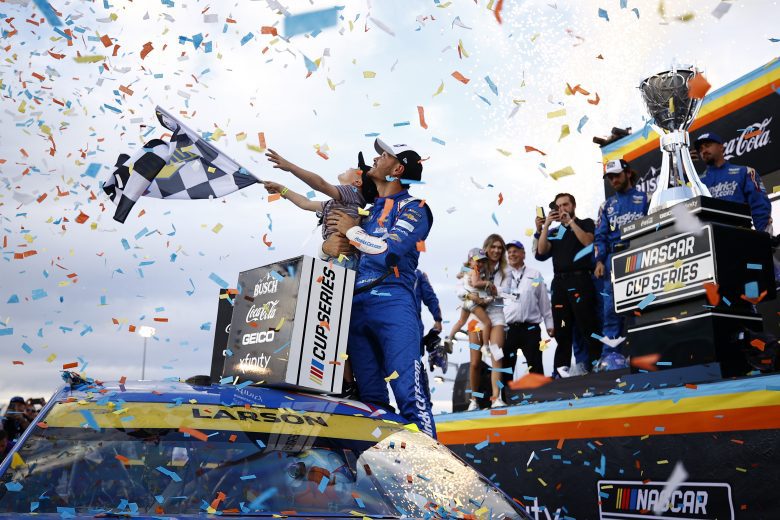 AVONDALE, ARIZONA - NOVEMBER 07: Kyle Larson, driver of the #5 HendrickCars.com Chevrolet, celebrates with his son, Owen as his wife, Katelyn, and daughter Audrey look on in victory lane after winning the NASCAR Cup Series Championship at Phoenix Raceway on November 07, 2021 in Avondale, Arizona. (Photo by Jared C. Tilton/Getty Images) | Getty Images