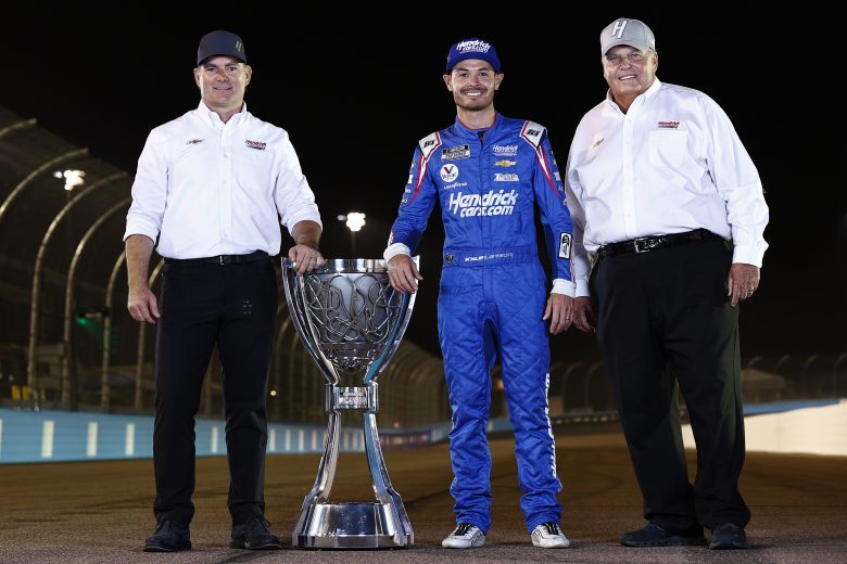 AVONDALE, ARIZONA - NOVEMBER 07: Kyle Larson, driver of the #5 HendrickCars.com Chevrolet, Jeff Gordon, Vice Chairman of Hendrick Motorsports and NASCAR Hall of Famer and team owner Rick Hendrick pose for photos after winning the NASCAR Cup Series Championship at Phoenix Raceway on November 07, 2021 in Avondale, Arizona. (Photo by Sean Gardner/Getty Images) | Getty Images