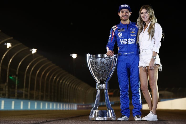 AVONDALE, ARIZONA - NOVEMBER 07: Kyle Larson, driver of the #5 HendrickCars.com Chevrolet, and wife, Katelyn pose for photos after the NASCAR Cup Series Championship at Phoenix Raceway on November 07, 2021 in Avondale, Arizona. (Photo by Sean Gardner/Getty Images) | Getty Images