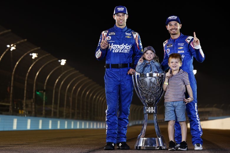 AVONDALE, ARIZONA - NOVEMBER 07: Crew chief Cliff Daniels, Kyle Larson, driver of the #5 HendrickCars.com Chevrolet, his son,Owen and daughter Audrey pose for photos after the NASCAR Cup Series Championship at Phoenix Raceway on November 07, 2021 in Avondale, Arizona. (Photo by Sean Gardner/Getty Images) | Getty Images