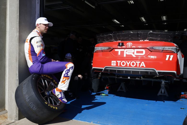 CONCORD, NORTH CAROLINA - NOVEMBER 17: Denny Hamlin driver of the #11 Joe Gibbs Racing Toyota waits to get back on the track during NASCAR Cup Series Next Gen testing at Charlotte Motor Speedway on November 17, 2021 in Concord, North Carolina. (Photo by Grant Halverson/Getty Images) | Getty Images
