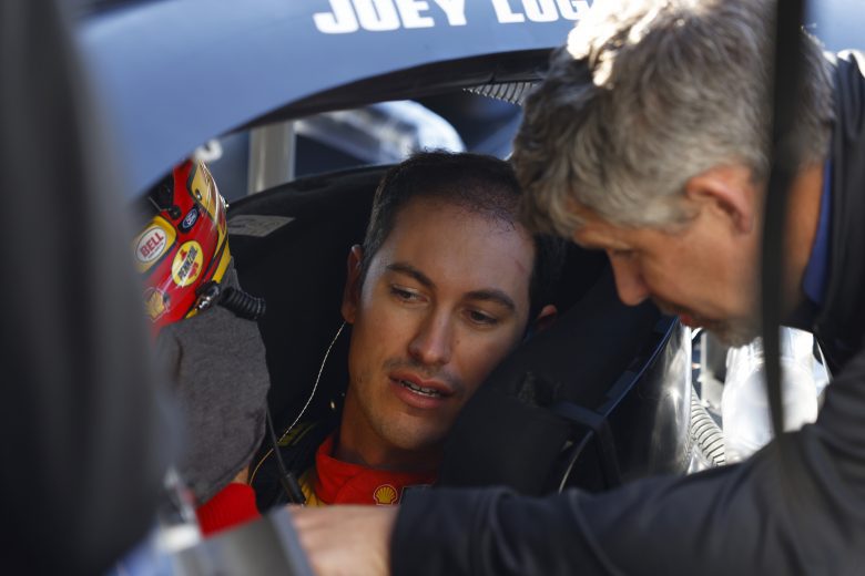 CONCORD, NORTH CAROLINA - NOVEMBER 17: Joey Logano talks with his crew before taking the #22 Penske Fords onto the track during NASCAR Cup Series Next Gen testing at Charlotte Motor Speedway on November 17, 2021 in Concord, North Carolina. (Photo by Grant Halverson/Getty Images) | Getty Images