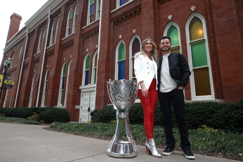 NASHVILLE, TENNESSEE - DECEMBER 01: The 2021 NASCAR Cup Series championship driver, Kyle Larson and his wife, Katelyn pose for photos at the Ryman Auditorium on December 01, 2021 in Nashville, Tennessee. (Photo by Sean Gardner/Getty Images) | Getty Images