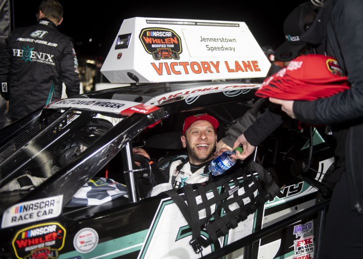 Justin Bonsignore, driver of the #51 Phoenix Communications Inc. Chevrolet, celebrates in victory lane after winning the Jennerstown Salutes 150 Presented By DGV for the NASCAR Whelen Modified Tour in Jennerstown, Pennsylvania on May 29, 2021. (Nate Smallwood/NASCAR)