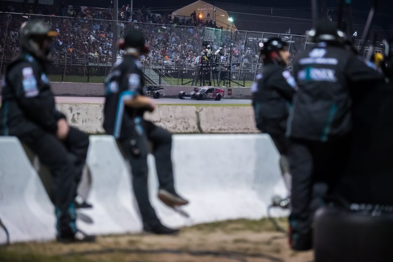 The pit crew of Justin Bonsignore, driver of the #51 Phoenix Communications Inc. Chevrolet, watches the track during the GAF Roofing 150 presented by Riverhead Building Supply for the NASCAR Whelen Modified Tour at Stafford Motor Speedway in Stafford Springs, Connecticut on August 6, 2021. (Adam Richins/NASCAR)