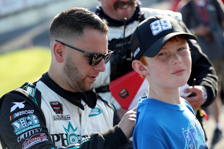 Justin Bonsignore, driver of the #51 Phoenix Communications, Inc. Chevrolet, signs a shirt during the Toyota Mod Classic 150 for the NASCAR Whelen Modified Tour at At Oswego Speedway in Oswego, New York on September 4, 2021. (Bryan Bennett/NASCAR)